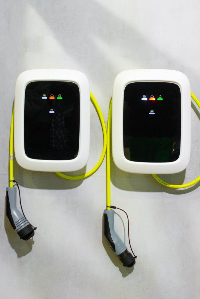 A modern electrical fast charger for the electrical or hybrid PHEV automobiles. An Energy power of future. Ecology friendly charger concept. Home electric car battery charger